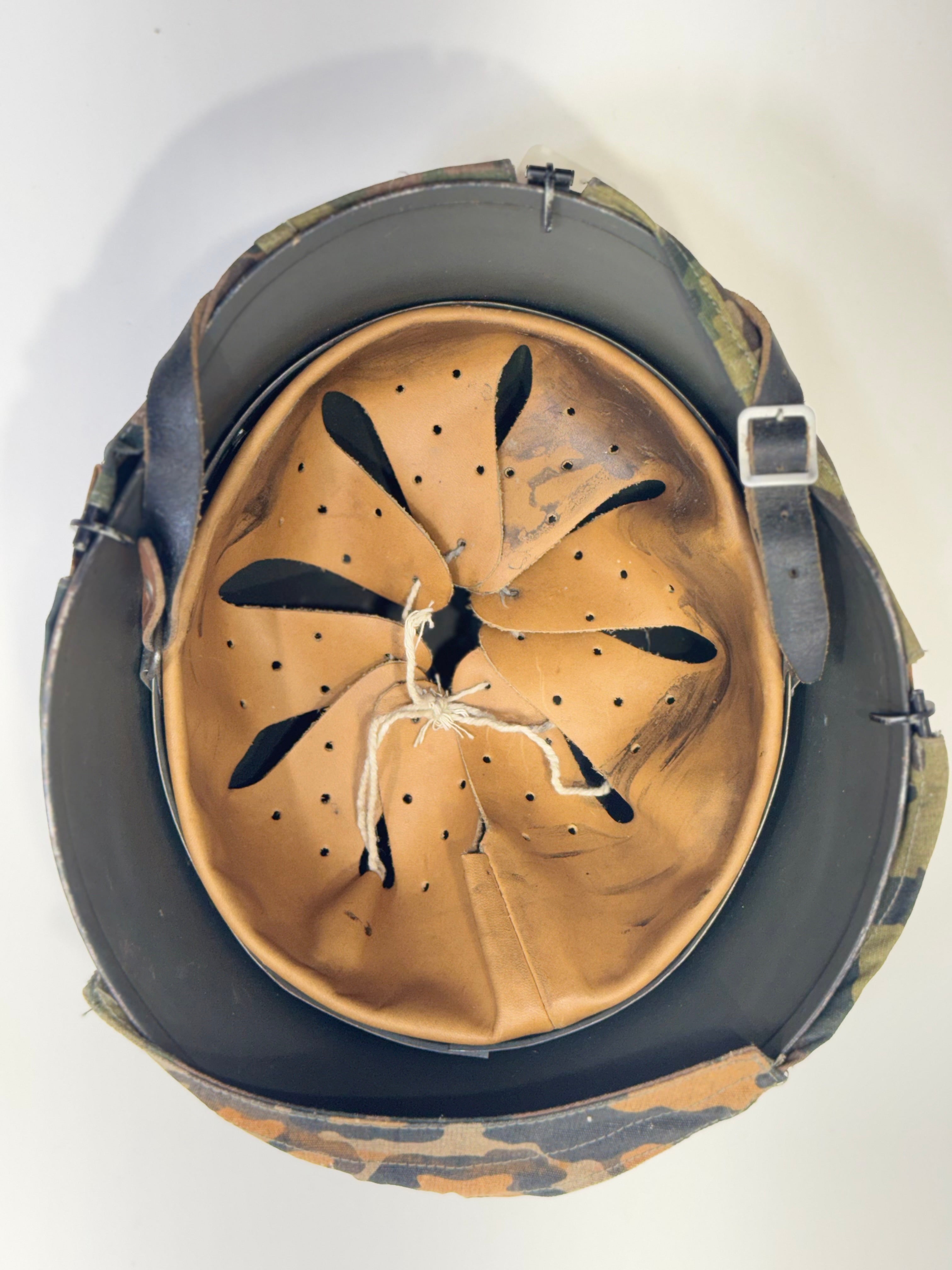 Vintage German helmet with reversible cover